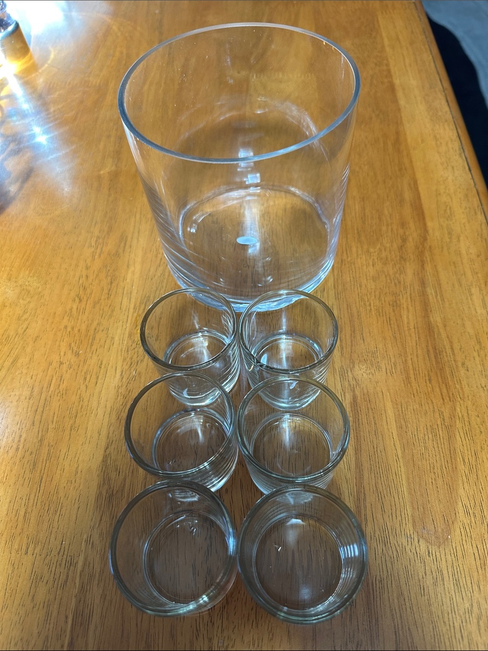 Clear glass vase and size clear votive holders.